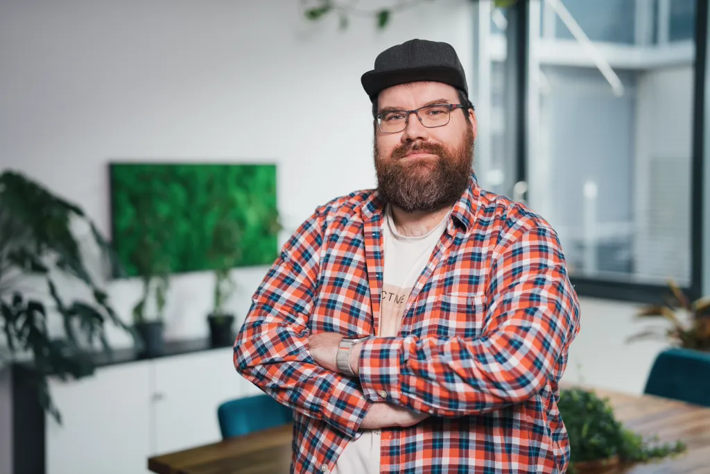 Marcel standing with his arms crossed